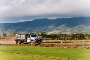 Truck driving on the farm at Southern Turf Hawaii.