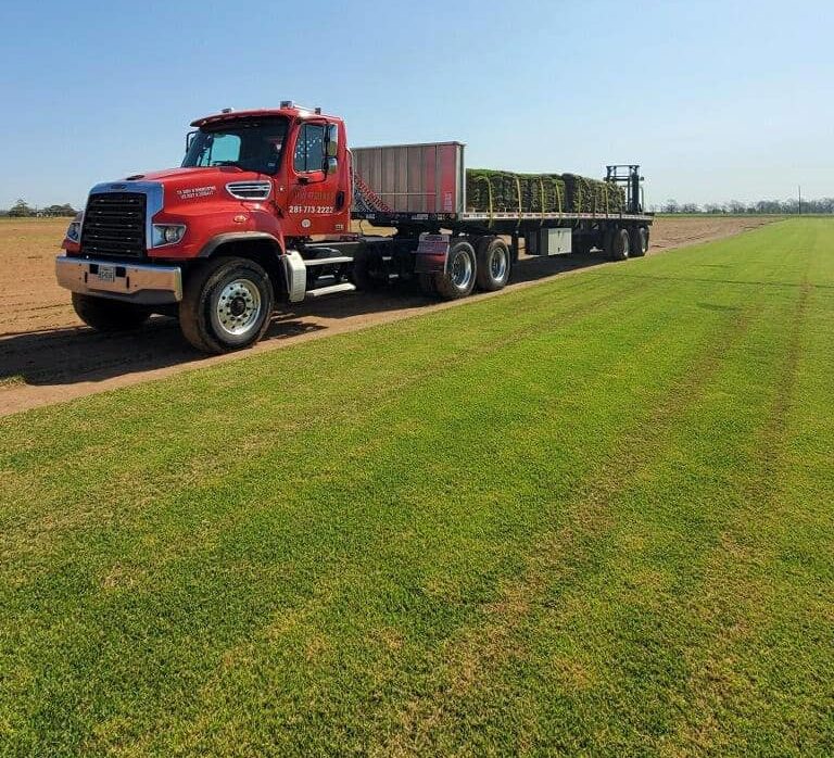 Planet Grass truck picking up sod from a farm.