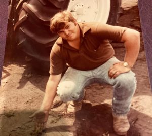 Shaun O'Brien planting sod in the 1980s at Duda Sod.
