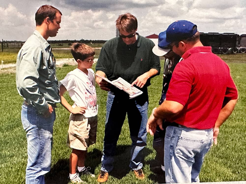 Drew Wagner visiting the turfgrass research facilities at the University of Florida at a young age with his dad, Tobey.