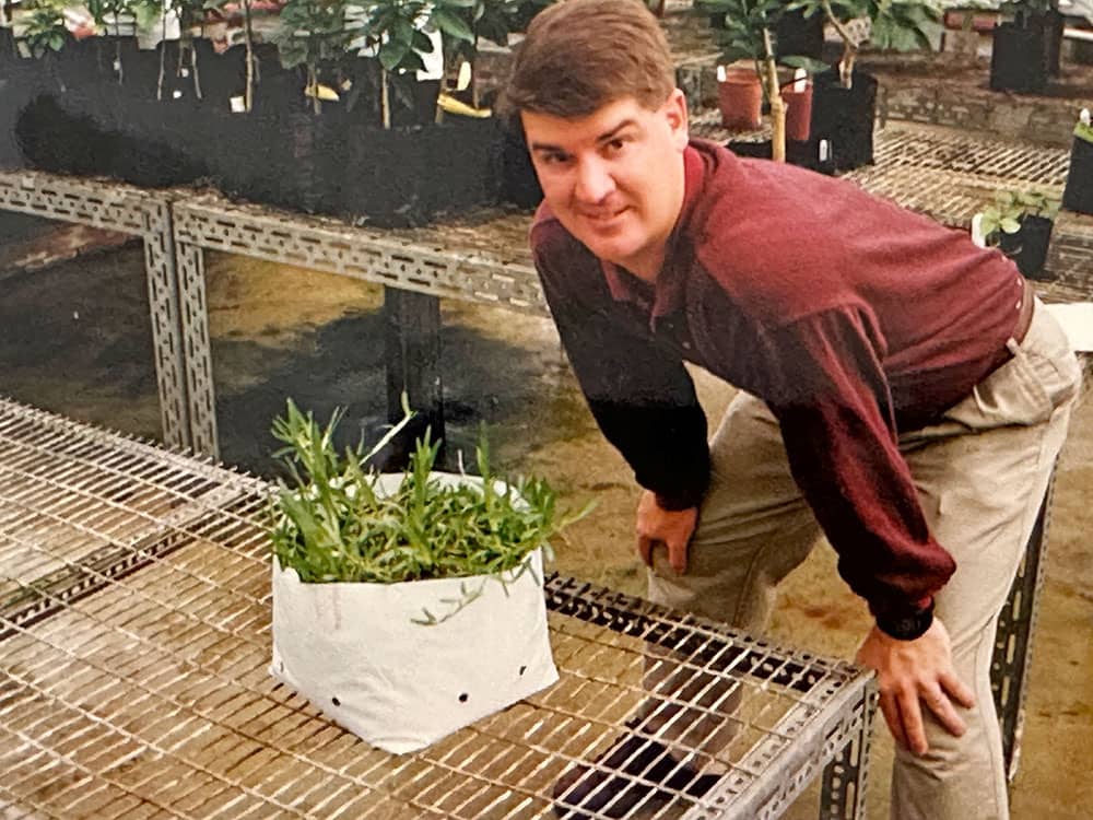 Tobey with Palmetto® St. Augustine in greenhouse in the 1990s.
