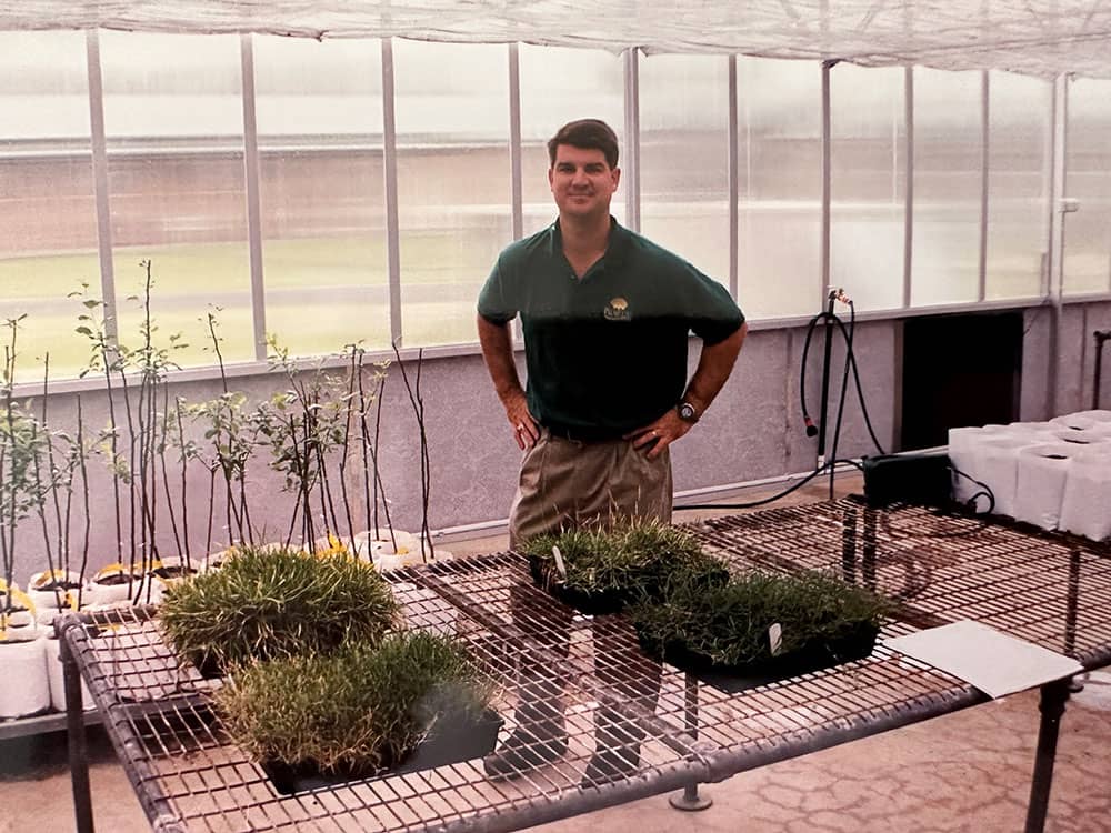 Tobey with Palmetto® St. Augustine in greenhouse in the 1990s.