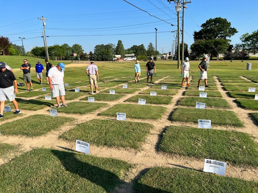 Attendees observing the research plots at the Mississippi State University Field Day.